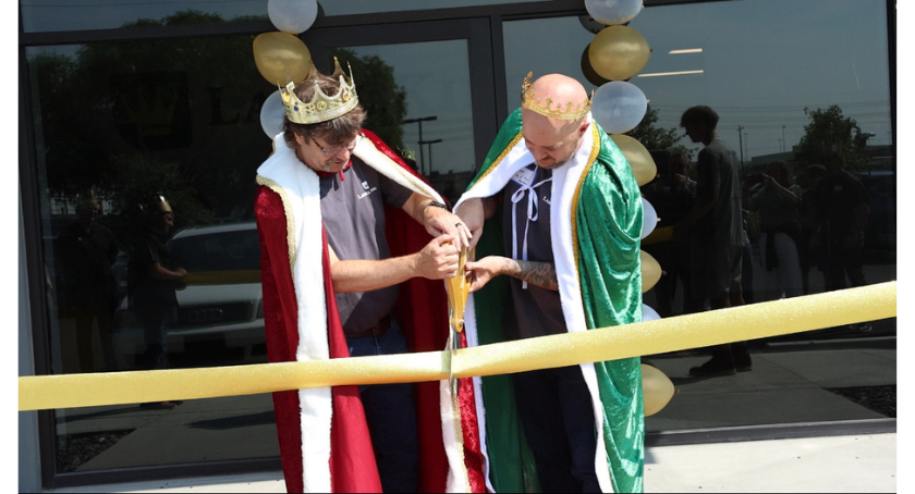 Robert Parker (L) and Adam Peek cut the ceremonial ribbon.